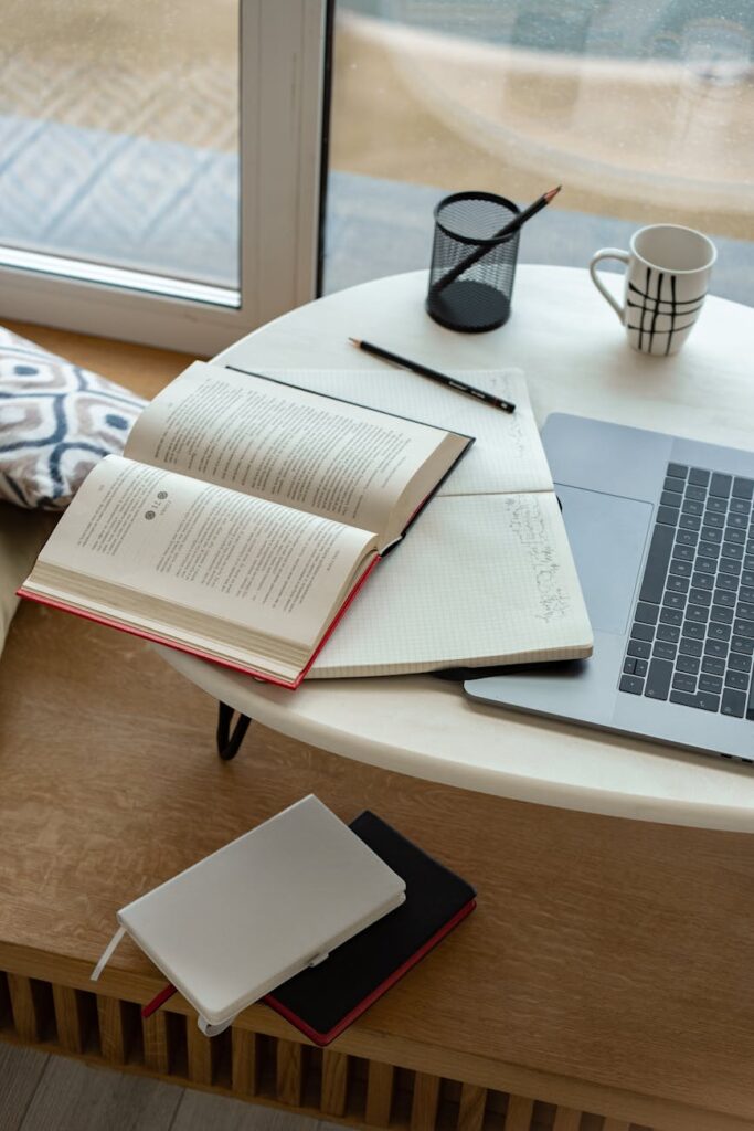 white notebook on wooden table