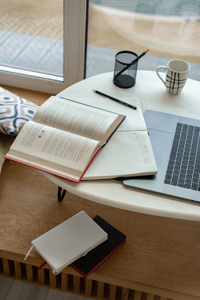 white notebook on wooden table